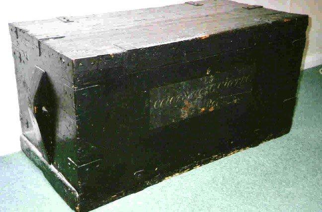 A Trunk and Letters in a Canvas Cutlery Holder