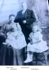 Thomas Breeze with his wife Emma Neale and his daughters, baby Doris, on lap and Helen seated.